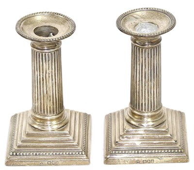 Lot 226 - A pair of silver candlesticks