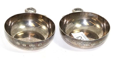 Lot 233 - A pair of silver tasters with snake handles, by Cooper Brothers