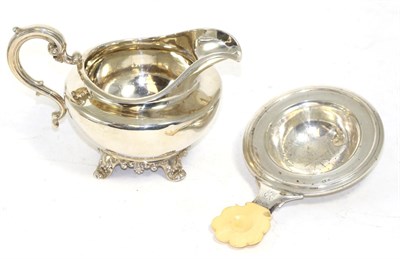 Lot 235 - A William IV silver cream jug, Joseph & John Angel, London 1832; and an Austrian silver tea...