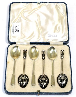 Lot 236 - A cased set of six silver gilt and enamel coffee spoons