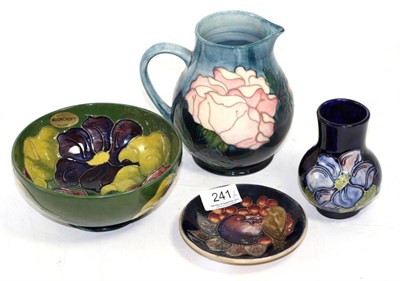 Lot 241 - Four pieces of Moorcroft comprising Clematis vase and bowl, Finch pattern dish & Rose jug (4)