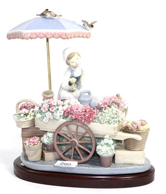 Lot 290 - A Lladro 'Flowers of the Season' figural group and stand (minor losses)