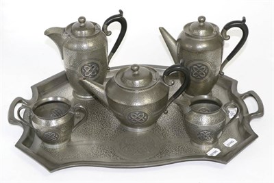 Lot 291 - An Edwardian inlaid mahogany mantel clock and a Roundhead hammered pewter six piece tea/coffee set