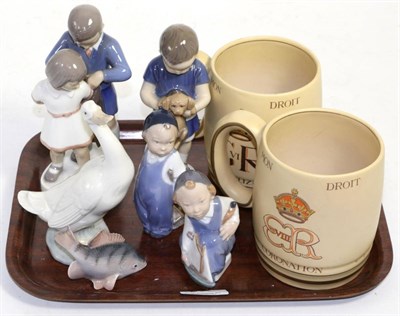 Lot 298 - A group of five Royal Copenhagen figures and models, two Coronation mugs