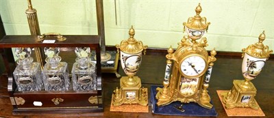 Lot 327 - A gilt metal and porcelain mounted reproduction striking mantel clock with garniture; together with