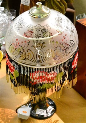 Lot 334 - A modern Moorcroft lamp with fringed, beaded shade