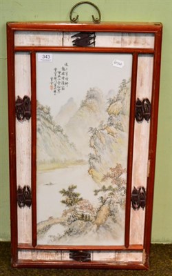 Lot 343 - A Chinese porcelain panel depicting a mountainous landscape, in a hardwood frame