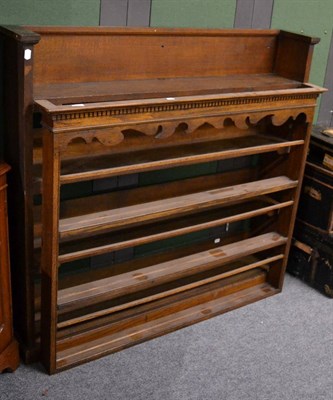 Lot 1101 - An oak open bookcase and an oak delft rack