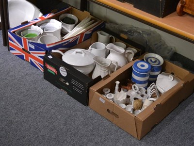 Lot 1105 - A quantity of white and cream glazed ceramics including jugs, egg cruets, serving plates, etc