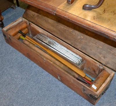 Lot 1119 - A wooden cased croquet set