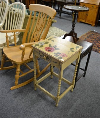 Lot 1121 - A modern rocking chair, a floral painted occasional table fitted with a drawer, an oak...