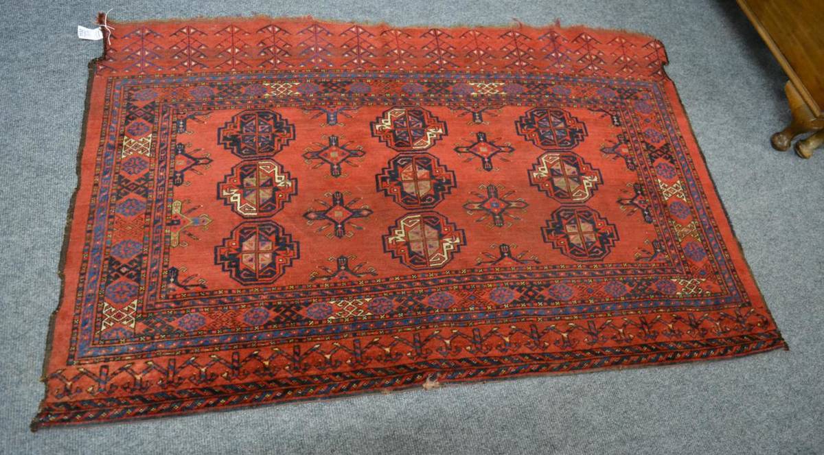 Lot 1132 - An Ersari Turkmen chuval, Emirate of Bukhara, the madder field with nine guls enclosed by...