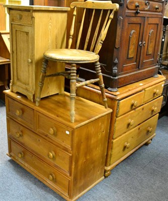 Lot 1147 - A group of pine furniture comprising two chests of drawers, a bedside cupboard and a chair