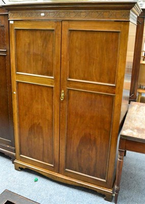 Lot 1154 - An early 20th century mahogany double fronted wardrobe