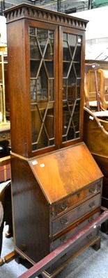 Lot 1158 - A mahogany astragal glazed bureau bookcase of narrow proportions