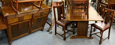 Lot 1160 - A 1920's oak dining suite comprising sideboard, table and four chairs