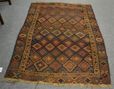 Lot 1170 - A late 19th century Jaff Kurd rug, Sanjabi, the indigo field of stepped lattice design enclosed...