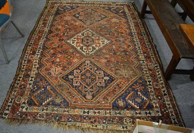 Lot 1175 - Khamseh carpet, South West Iran, the terracotta field with three linked medallions enclosed by...