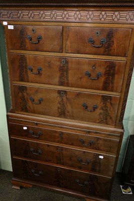 Lot 1235 - A 19th century mahogany chest on chest, fitted with a dressing slide and decorated with blind...