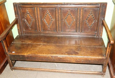 Lot 1241 - An 18th century provincial oak four panelled settle