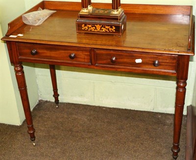 Lot 1243 - A mahogany two drawer side table