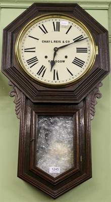 Lot 1245 - A striking drop dial wall clock, signed Charles Reis & Co, Glasgow