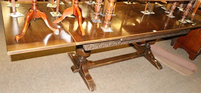 Lot 1267 - A 1920's oak extending dining table