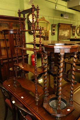 Lot 1278 - A 1920's oak umbrella stand, together with an inlaid mahogany plant stand and a four tier...