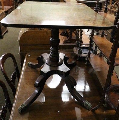 Lot 1280 - A Regency mahogany flip top table on turned legs