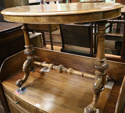 Lot 1281 - A Victorian walnut oval occasional table, the turned and carved supports joined by a stretcher rail