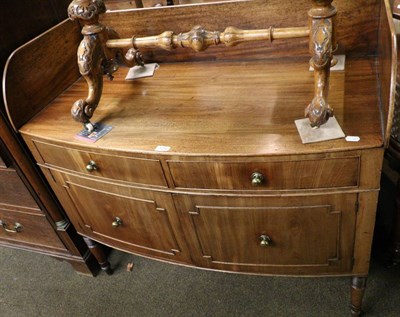 Lot 1282 - A mahogany bow fronted sideboard with high gallery