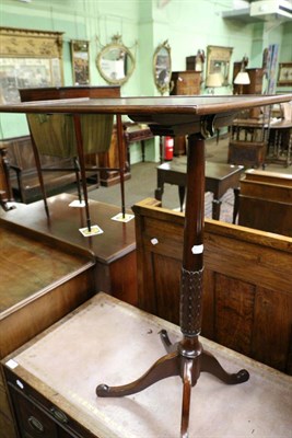 Lot 1293 - A cross banded mahogany oval drop leaf occasional table, together with a later mahogany folding...