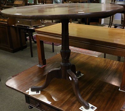 Lot 1302 - A George III mahogany circular tilt top tripod table