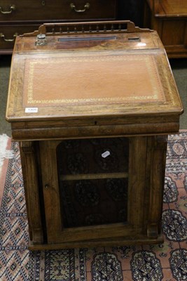 Lot 1305 - An inlaid walnut davenport with birds eye maple interior