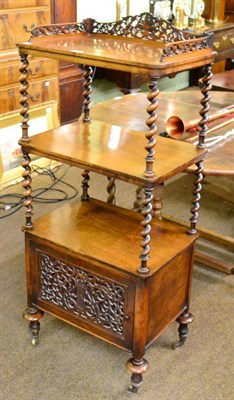 Lot 1310 - A Victorian mahogany whatnot, with pierced and carved gallery and boldly turned uprights