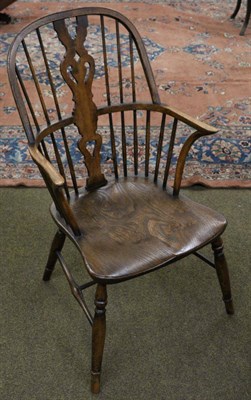 Lot 1321 - An elm spindle back Windsor armchair