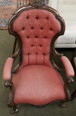 Lot 1322 - A Victorian carved mahogany framed button back open armchair