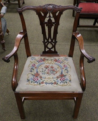 Lot 1335 - An 18th century carved mahogany open armchair with drop in needlework seat