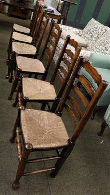 Lot 1340 - A composite set of six rush seated ladder back dining chairs