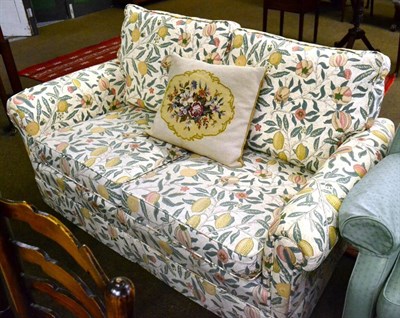 Lot 1342 - A modern two seater sofa decorated with William Morris 'Fruits' pattern fabric