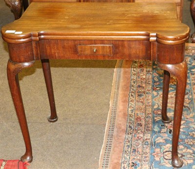 Lot 1345 - A 19th century mahogany fold over tea table