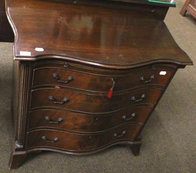 Lot 1356 - A 20th century mahogany serpentine fronted four height chest of drawers, fitted with a dressing...