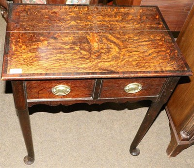 Lot 1357 - An 18th century oak side table fitted with two short drawers