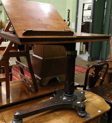 Lot 1359 - A William IV mahogany draftsman's table, the rectangular top with easel backed section, stamped...