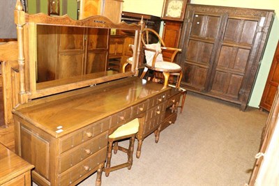 Lot 1379 - A reproduction mirrored dressing table, together with a matching double headboard with integral...