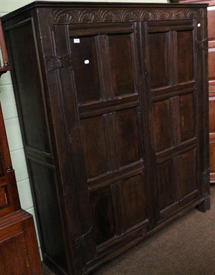 Lot 1387 - An 18th century oak armoire