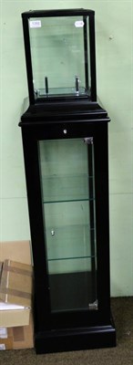 Lot 1392 - A modern glass mantel clock on a pedestal display case