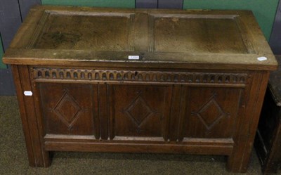 Lot 1394 - A carved and panelled oak coffer (a.f)