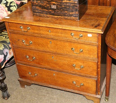 Lot 1397 - A George III oak four height chest of drawers