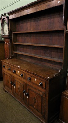 Lot 1409 - An early 19th century oak dresser and rack